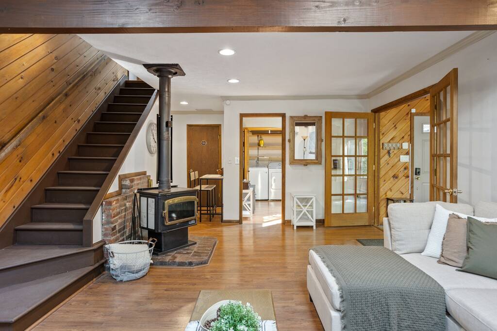 Open Entry and Staircase View
This wide view captures the warm wood tones and welcoming layout as you enter, with a beautiful staircase anchoring the space.