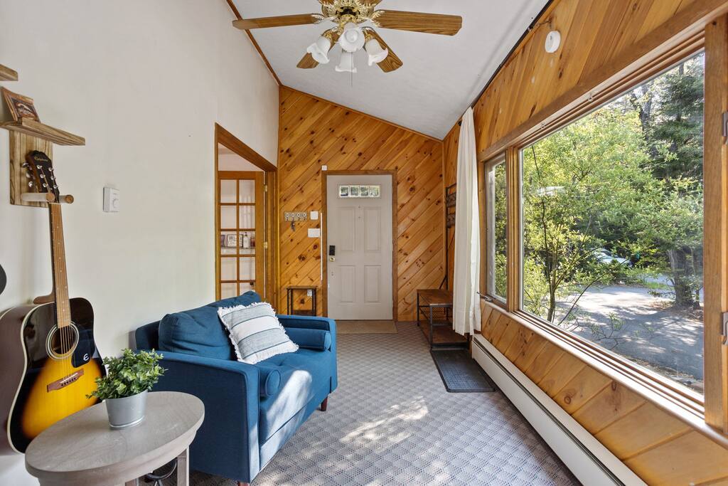 An artful display of instruments meets soft greenery, blending function and style for music lovers and design enthusiasts alike.