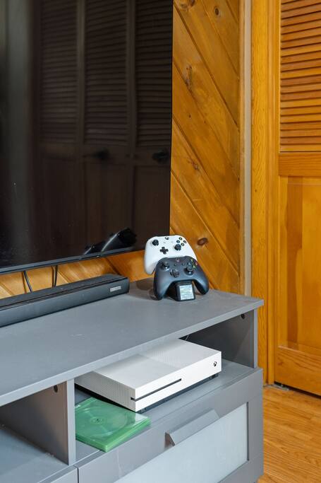 Ready for movie night or game time, this setup includes a flat-screen TV and game console for laid-back evenings in.