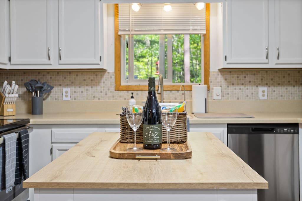 Kitchen Island Detail
A cozy and stylish kitchen moment featuring a butcher block island, champagne-ready setup, and sunlight filtering through the window.