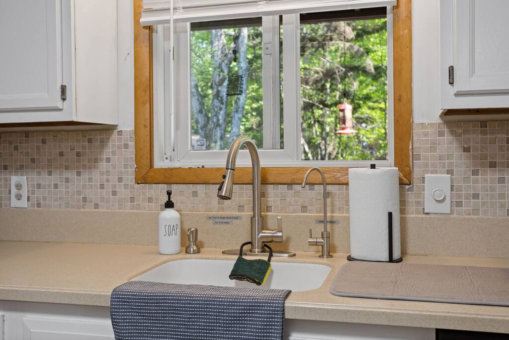 Window Over Sink Detail
Sunlight streams in above the sink, where neutral counters and simple decor keep things clean, cozy, and functional.