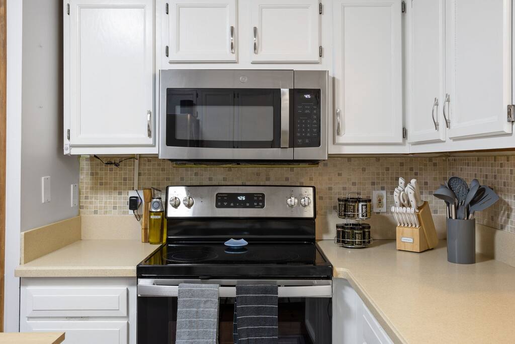 Stainless Stove and Microwave Corner
A modern cooking space with updated appliances and everything you need to whip up a quick meal or holiday feast.