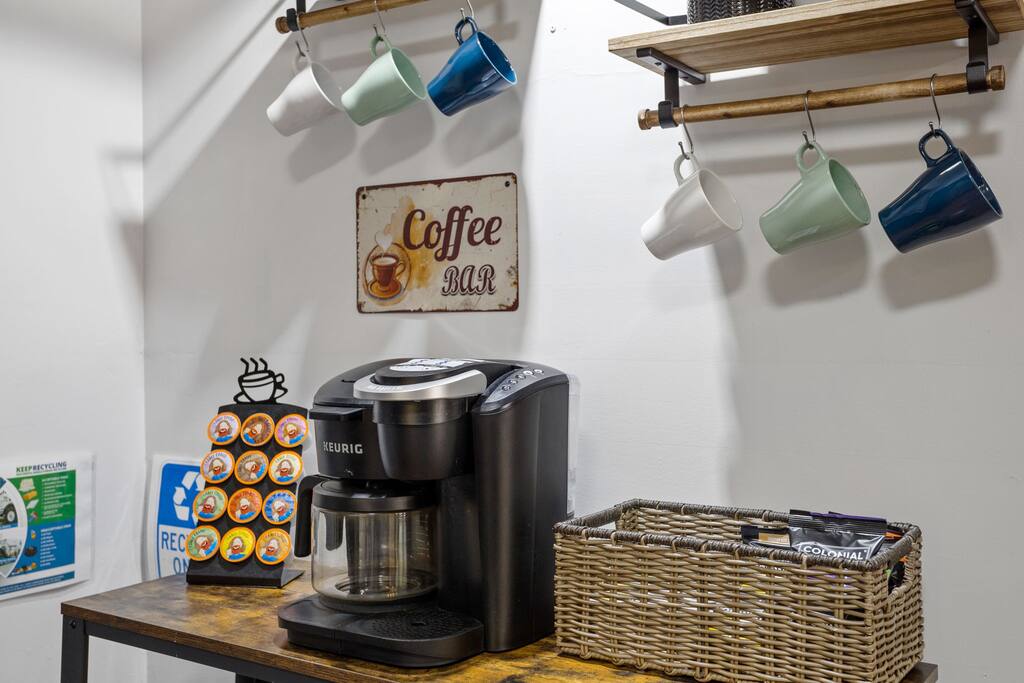 Coffee Station with Mugs
Start your morning right with this dedicated coffee nook, complete with a Keurig, mugs on display, and a basket full of grab-and-go options.