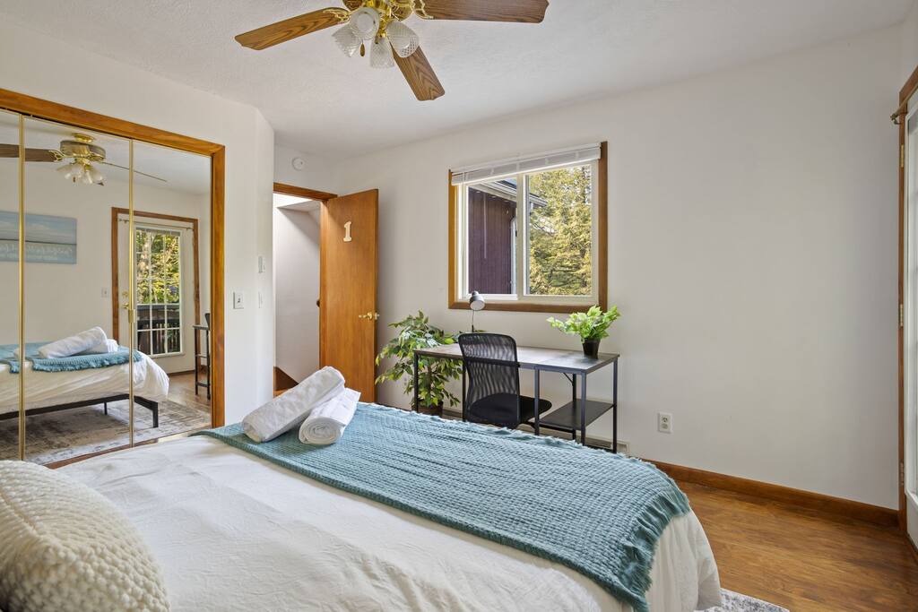 Angle with Desk and Mirror Closet
A cozy, functional setup with a large mirror closet, writing desk, and gentle light flowing in to make the space feel open and relaxed.