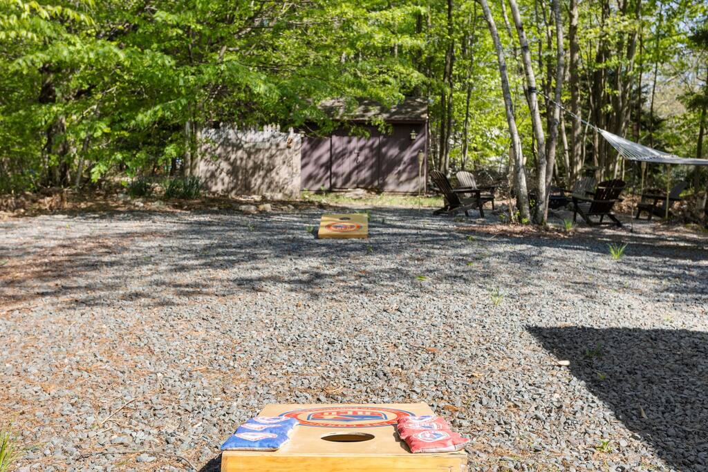 Cornhole and Outdoor Games Area
Gravel yard space with plenty of room to play. Set up for cornhole and other games while staying cool in the shade.
