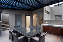 Patio with outdoor kitchen and dining