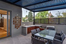 Patio with outdoor kitchen and dining