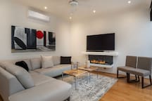 2nd living room with TV and fireplace
