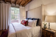 Luxury King Bed with Hotel Linens and Full Length Curtains