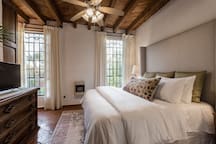 Luxury King Bed with Floor-length Curtains and Blackout Shades