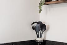 Kitchen with Stove Top and Cookware Essentials